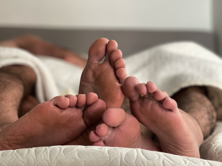 Gay couple feet cover image