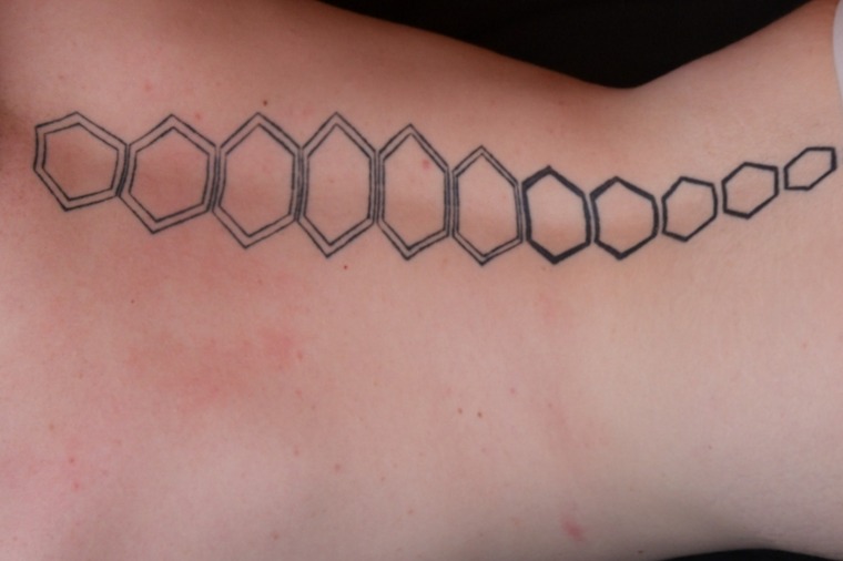 Boy with the hexagon tattoo banner image
